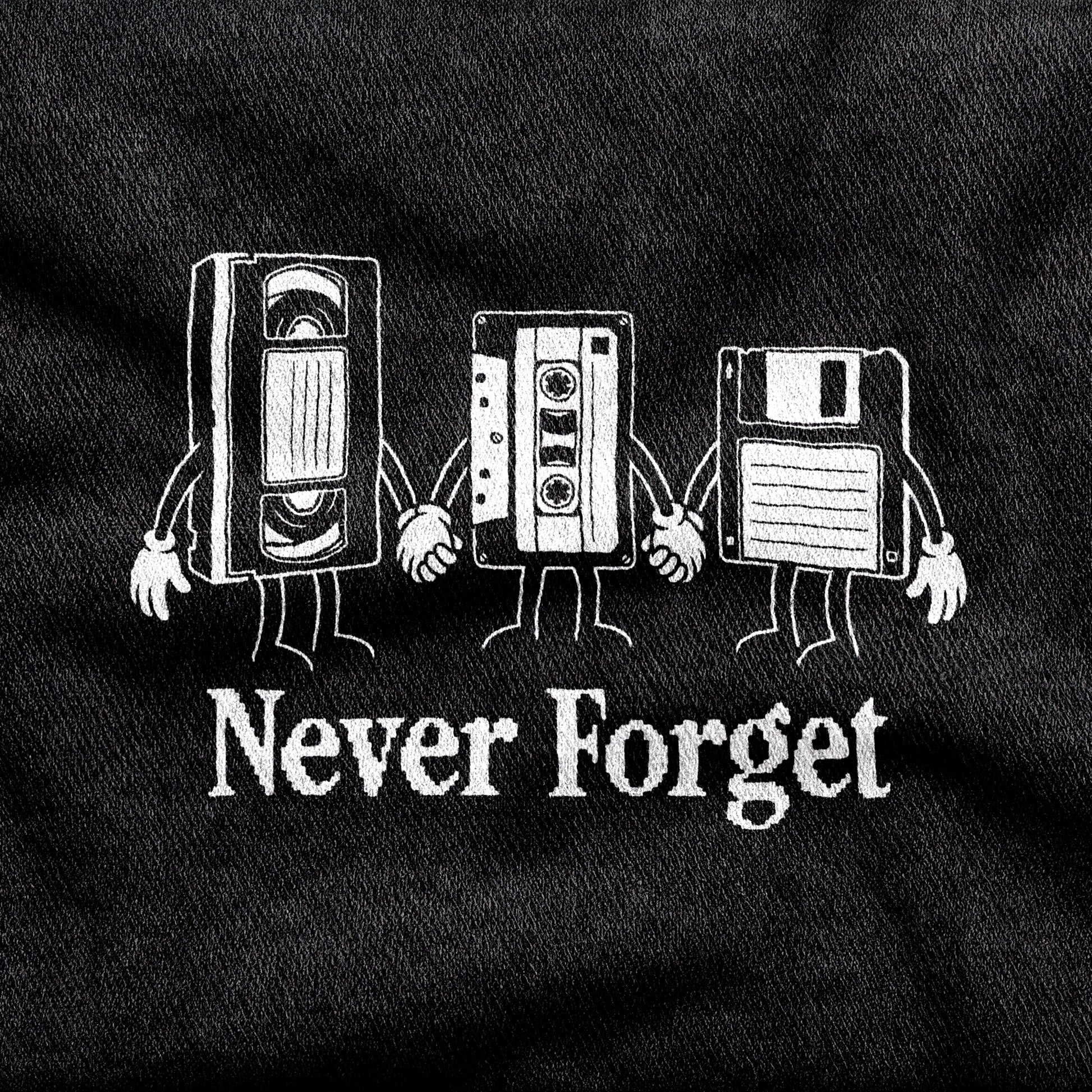 Never Forget design printed on a black cotton tee, close-up