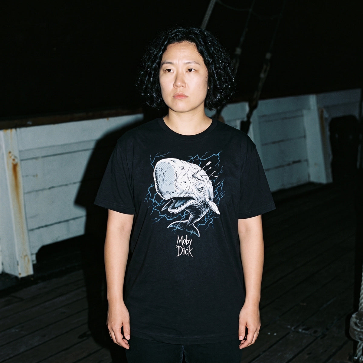 Woman wearing the Moby Dick black graphic tee