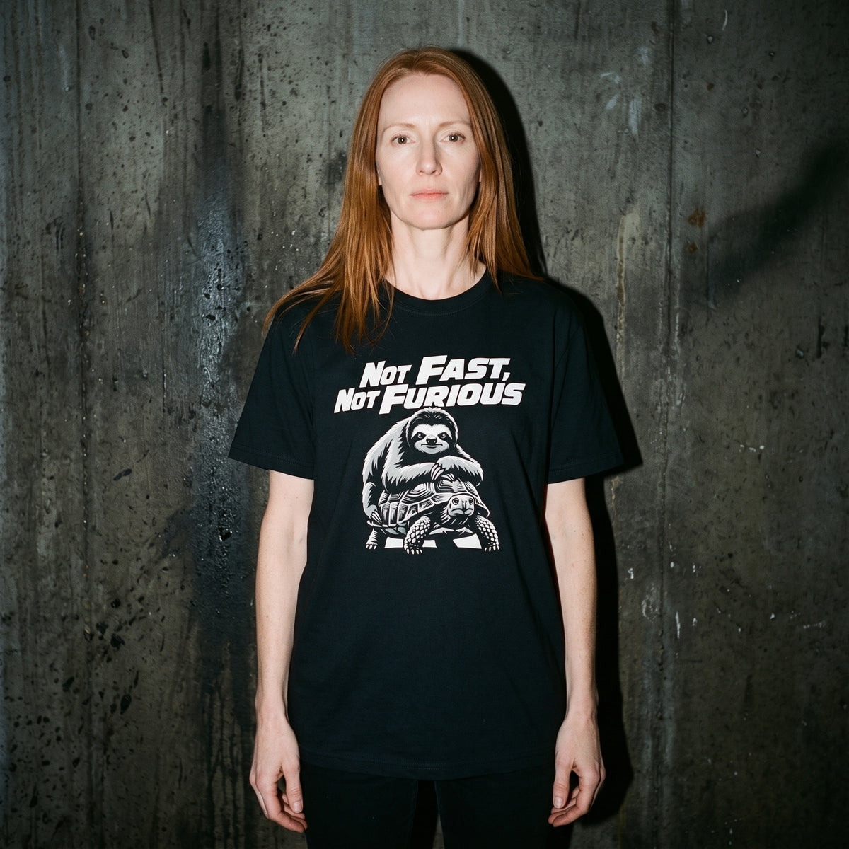 Woman wearing the Not Fast, Not Furious black graphic tee