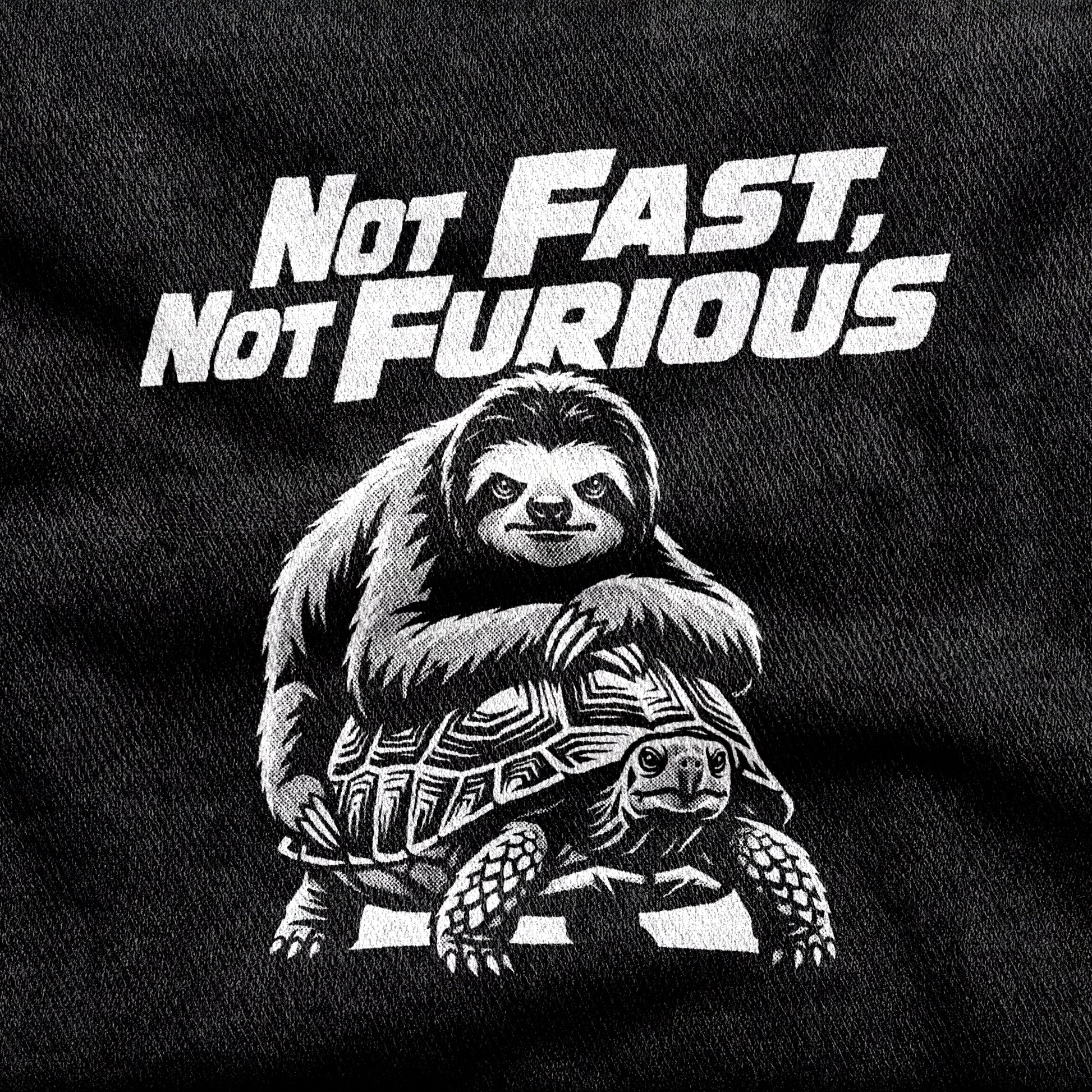 Not Fast, Not Furious design printed on a black cotton tee, close-up
