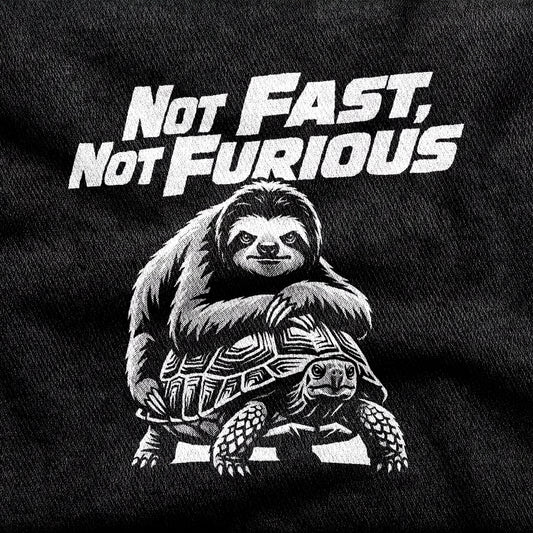 Not Fast, Not Furious design printed on a black cotton tee, close-up