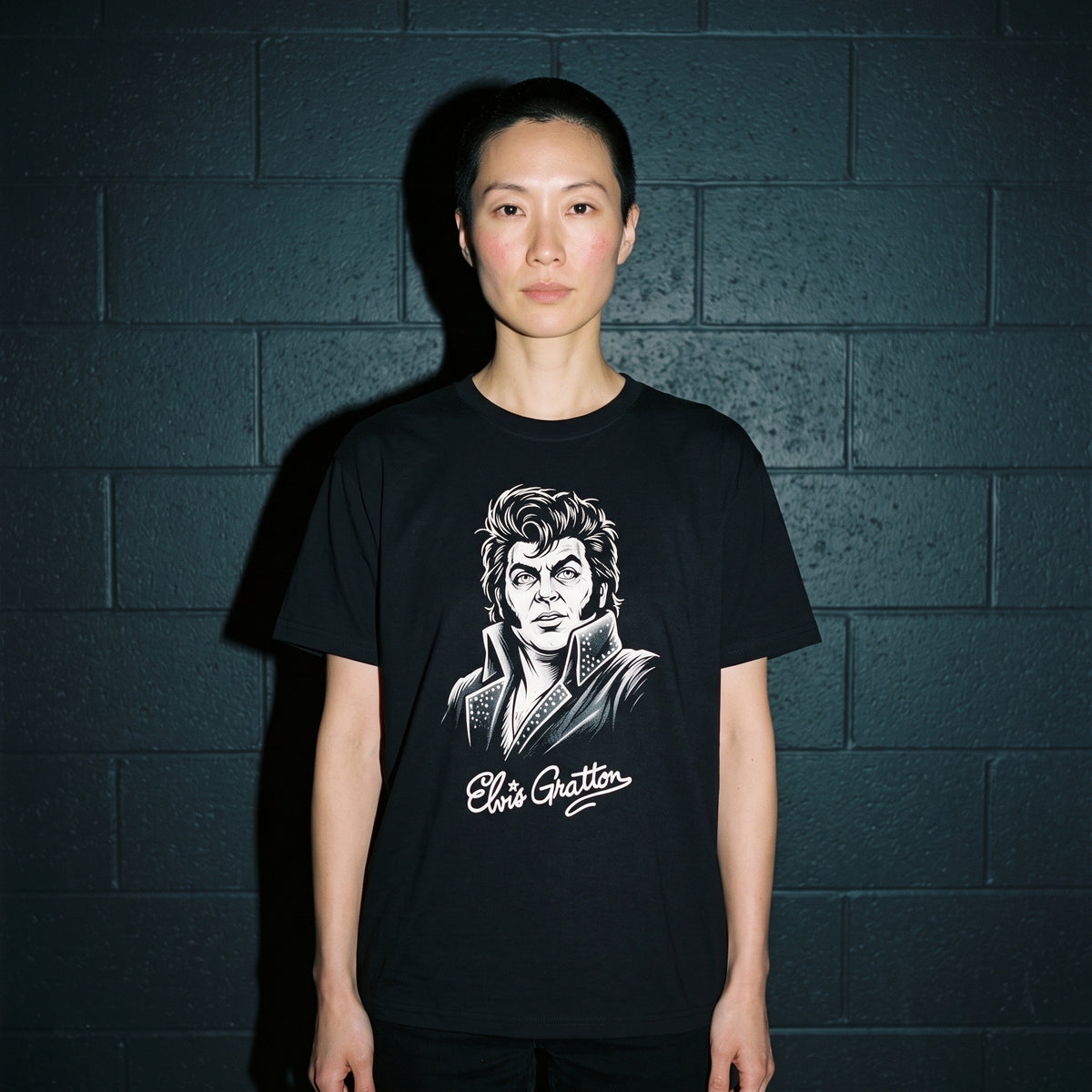 Woman wearing the Elvis Gratton black graphic tee