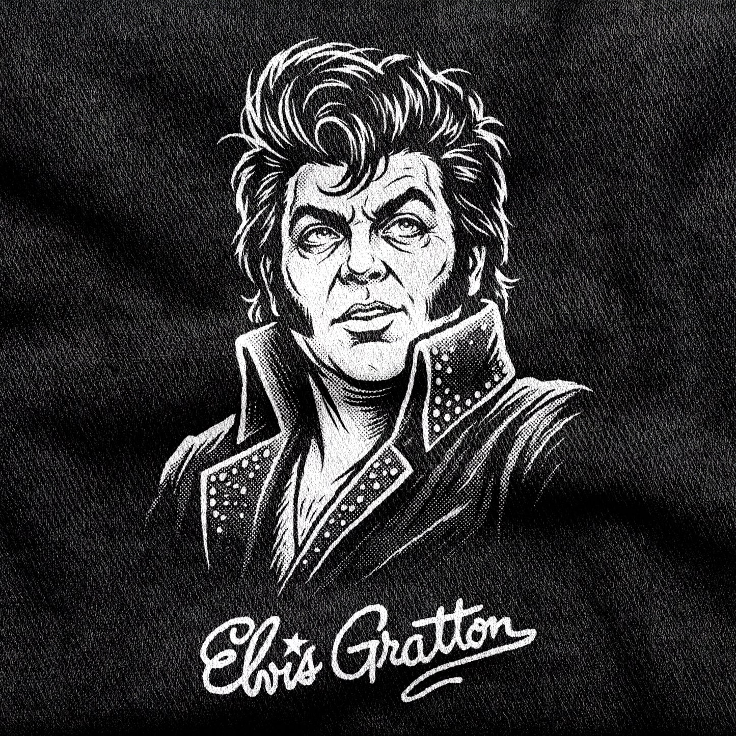 Elvis Gratton design printed on a black cotton tee, close-up