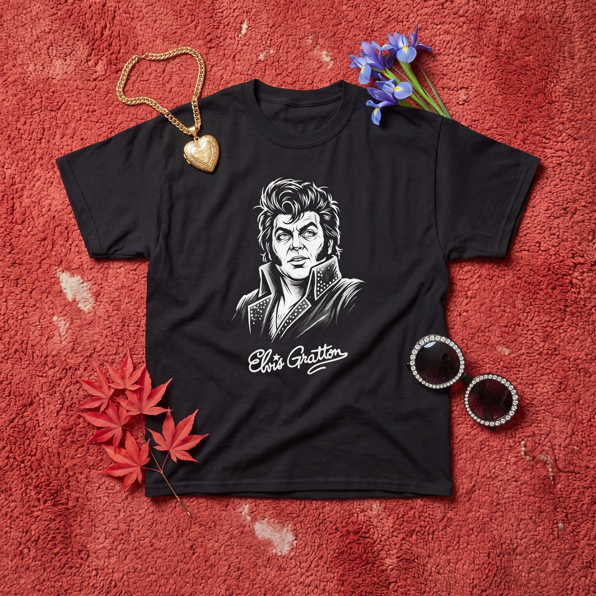 Elvis Gratton black graphic tee, styled flat lay