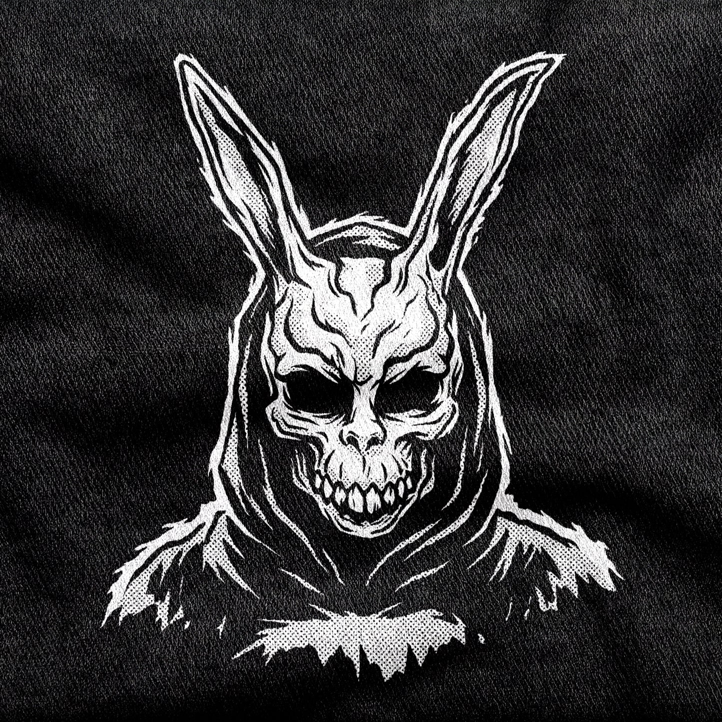 Donnie Darko design printed on a black cotton tee, close-up