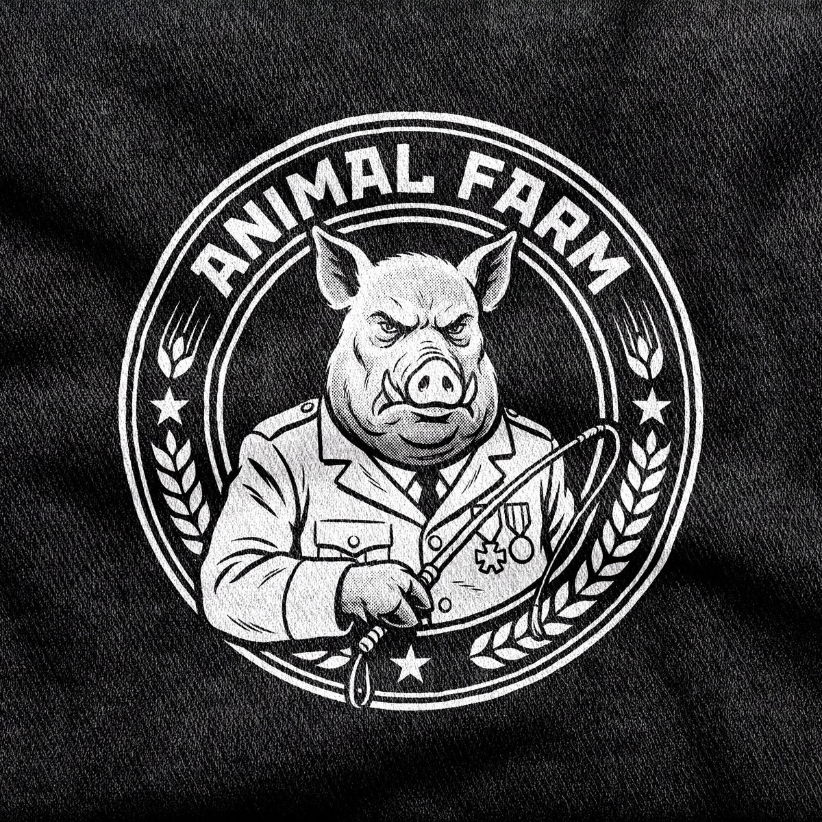 Animal Farm design printed on a black cotton tee, close-up