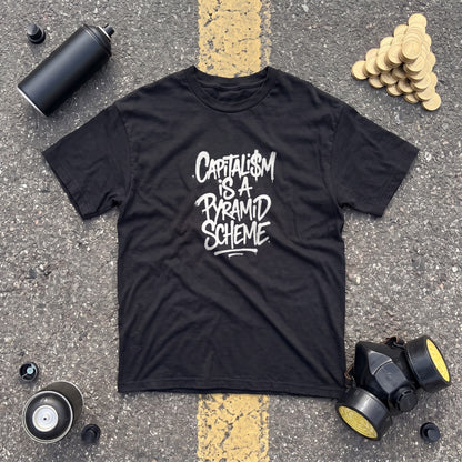 Capitalism is a Pyramid Scheme black graphic tee, styled flat lay