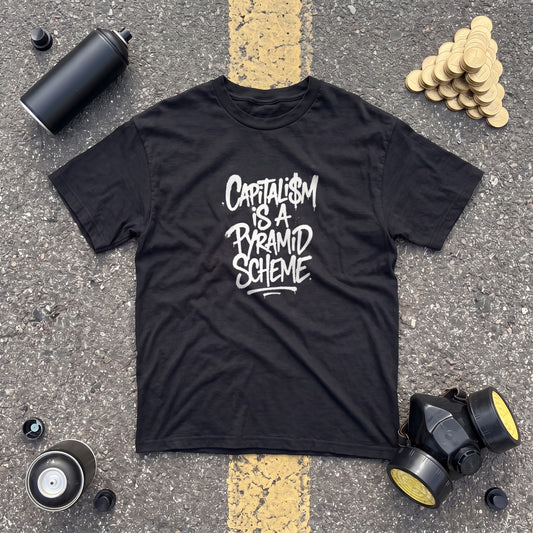 Capitalism is a Pyramid Scheme black graphic tee, styled flat lay