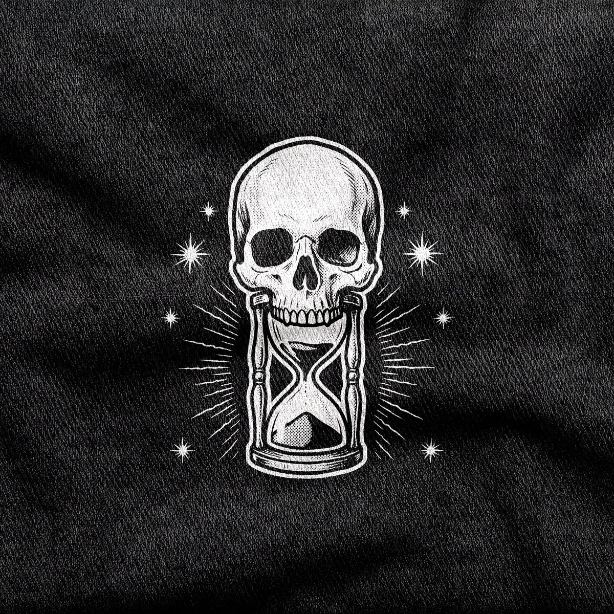 Memento Mori design printed on a black cotton tee, close-up