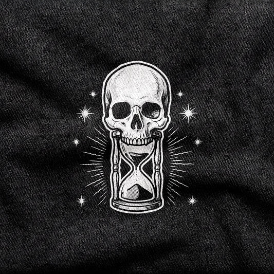 Memento Mori design printed on a black cotton tee, close-up