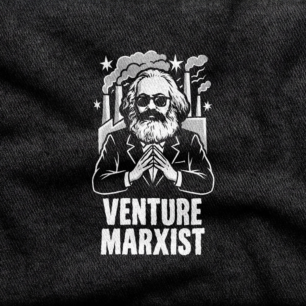 Venture Marxist design printed on a black cotton tee, close-up