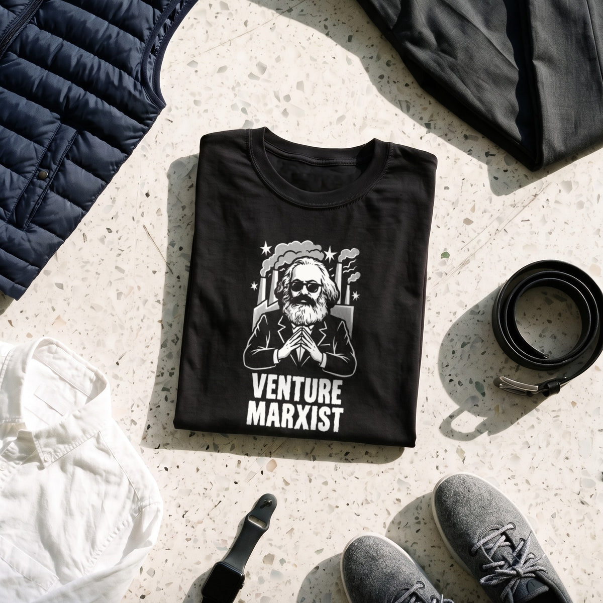 Venture Marxist black graphic tee styled in a flat lay with matching pieces
