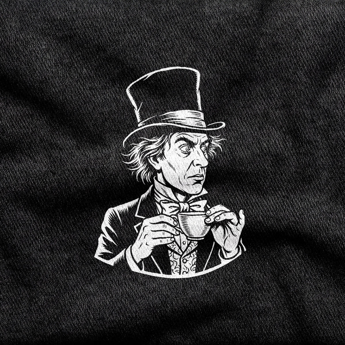 The Mad Hatter design printed on a black cotton tee, close-up
