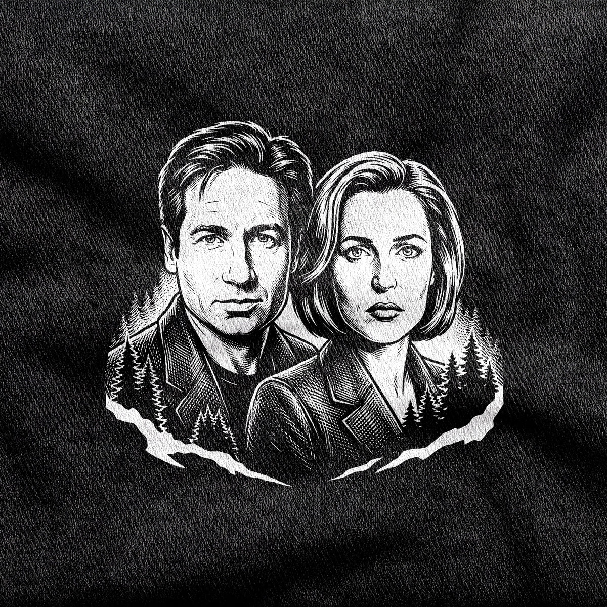 Mulder and Scully design printed on a black cotton tee, close-up