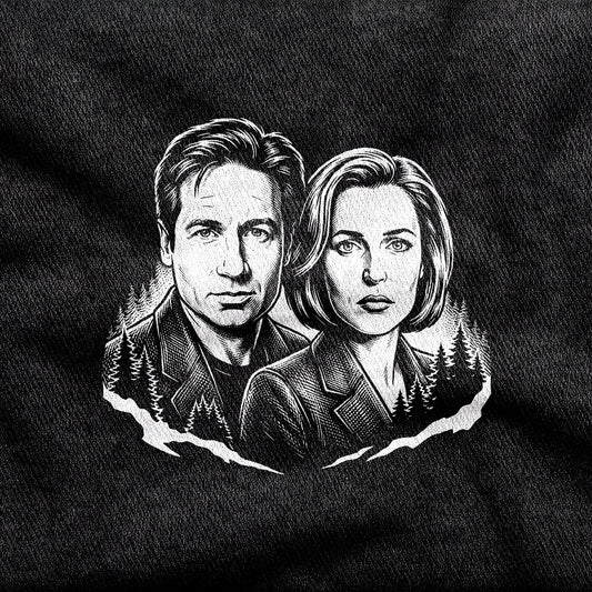 Mulder and Scully design printed on a black cotton tee, close-up