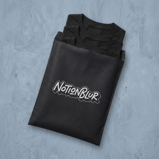 Three folded Notionblur tees in a black mailer on pale plaster
